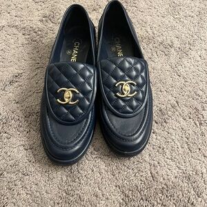 CHANEL Dark Blue Quilted Loafers with Gold Emblem